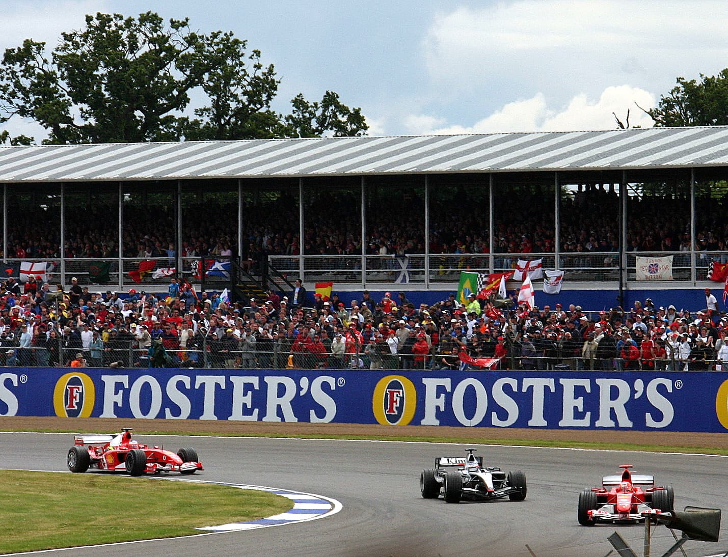 Historical Formula 1 photograph: Schumacher Räikkönen Barrichello Luffield, 2004